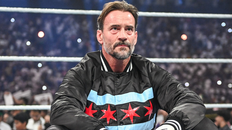 CM Punk wearing a black jacket