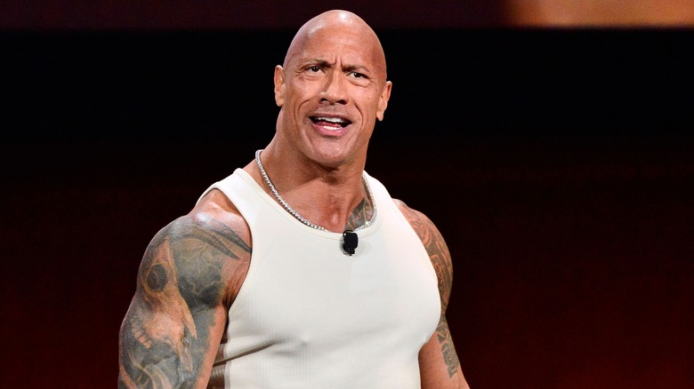 The Rock in a white shirt