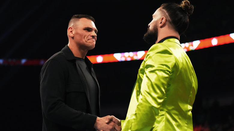GUNTHER and Seth Rollins shaking hands