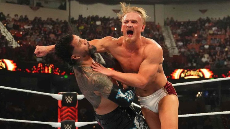 Ilja Dragunov hits Jey Uso with a clothesline in the middle of the ring during their King of the Ring quarterfinals match in the main event of "WWE Raw."