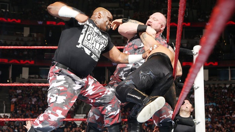 D-Von Dudley and Bubba Ray Dudley hitting Sin Cara with a double team move during a match on "RAW."