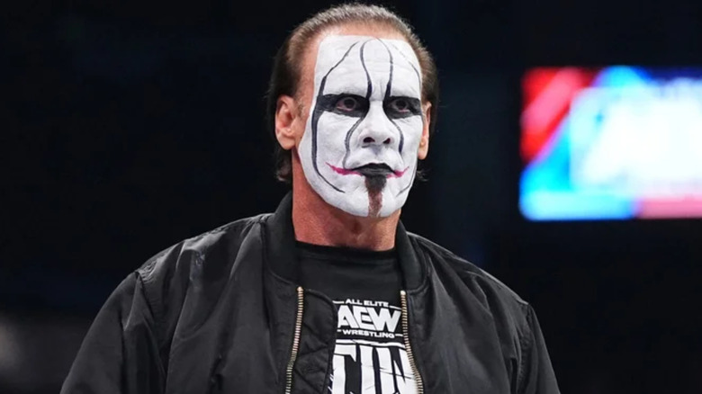 Sting wearing black and white face paint 
