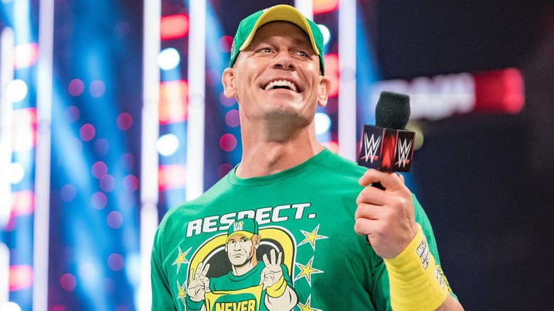 John Cena smiling with a mic in hand