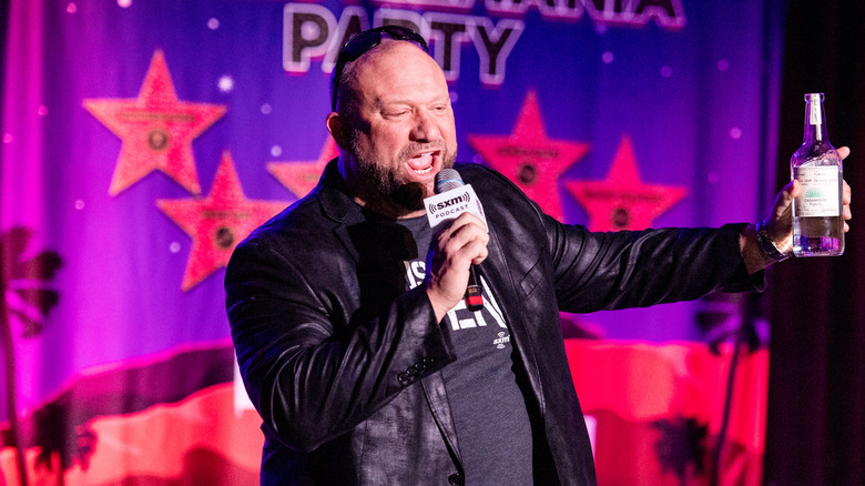 Bully Ray talking about something while holding a bottle
