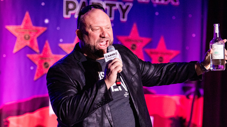 Bully Ray brandishing a bottle of tequila as he speaks