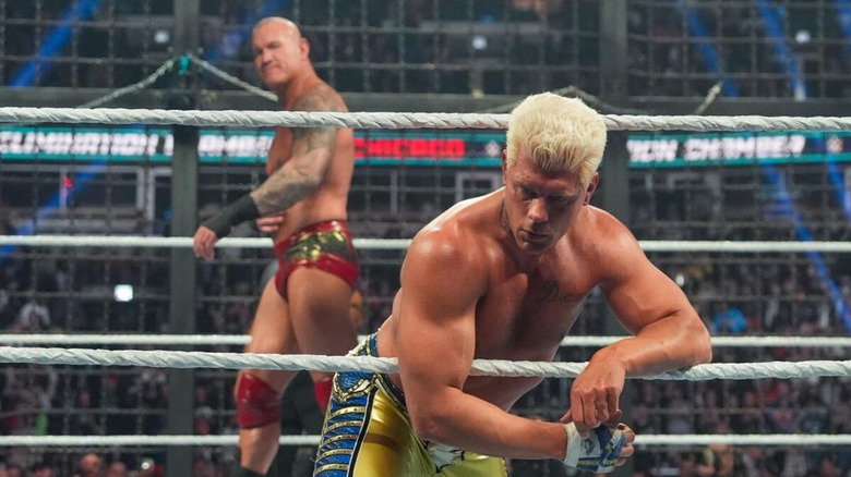 Cody Rhodes leans on the ropes as Randy Orton stalks him in the background during the final moments of the 2026 Elimination Chamber match.