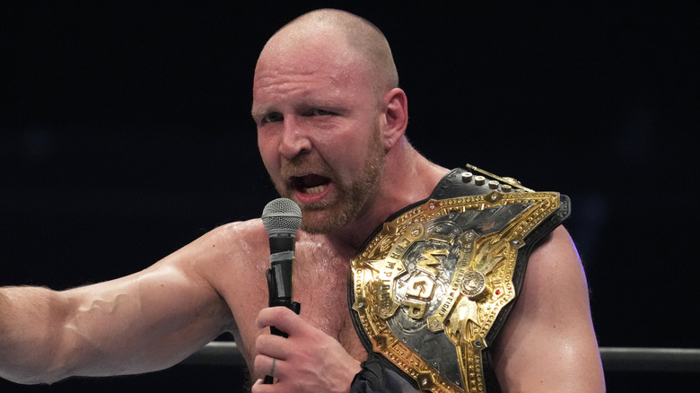 Jon Moxley with a title that he didn't keep in a briefcase