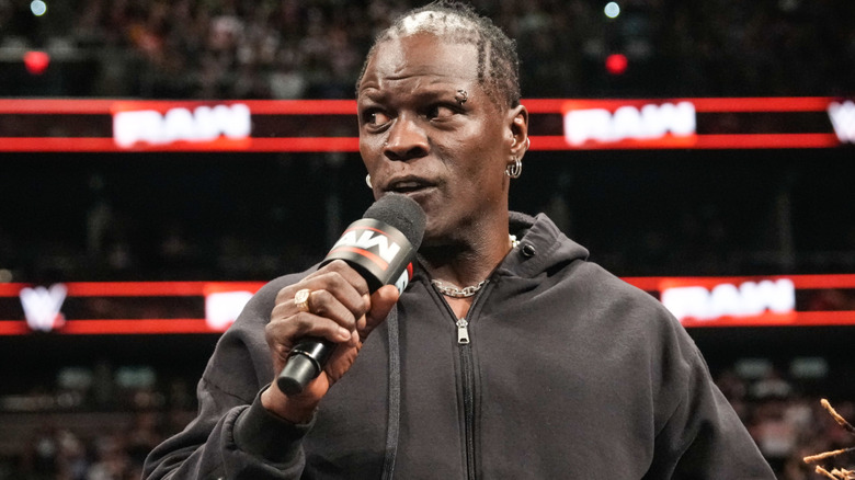 Ron Killings holding a microphone