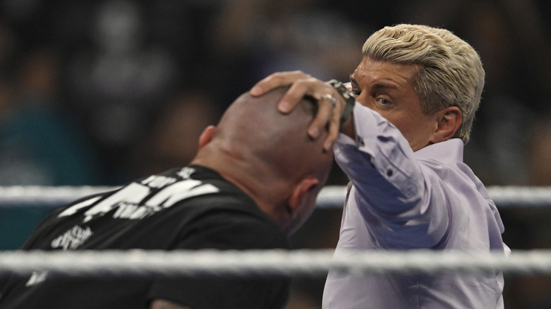 Cody Rhodes prepares to punch Randy Orton