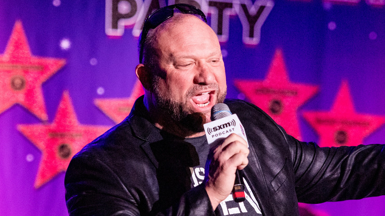 Bully Ray speaking into a SiriusXM mic at a Busted Open event