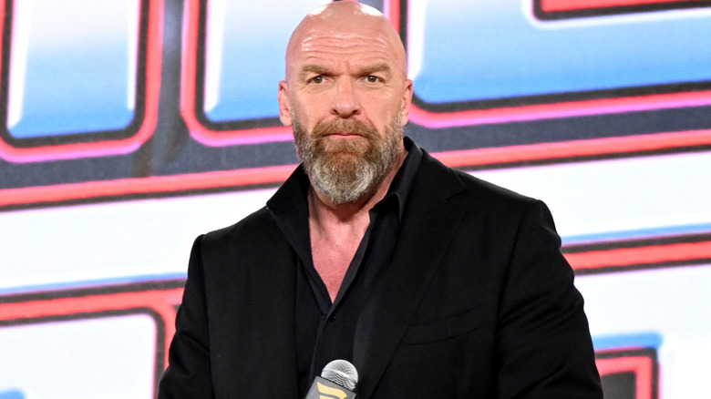 Triple H wearing a suit