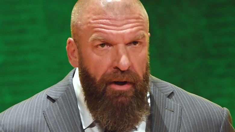 Triple H speaking at a conference