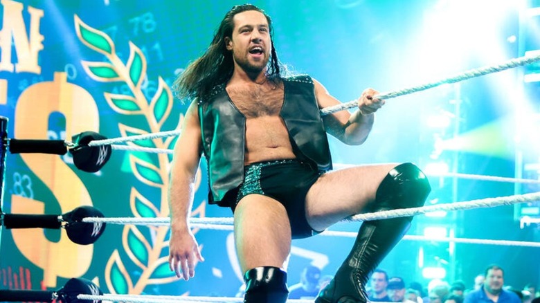 Cameron Grimes sits on the ropes as he enters the ring before a match on "WWE SmackDown."