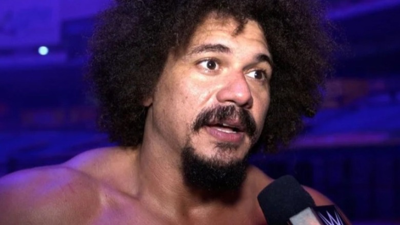 Carlito speaks during a backstage interview in WWE.