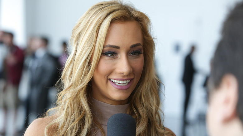 Carmella smiling