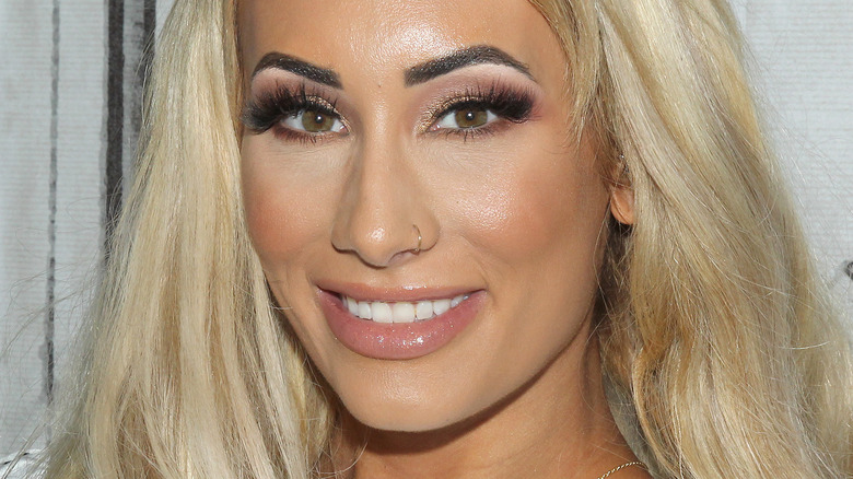 Carmella smiling