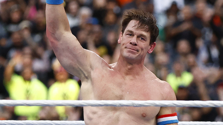 John Cena raises his arm