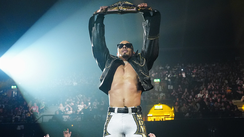 Carmelo Hayes lifting the WWE United States Championship