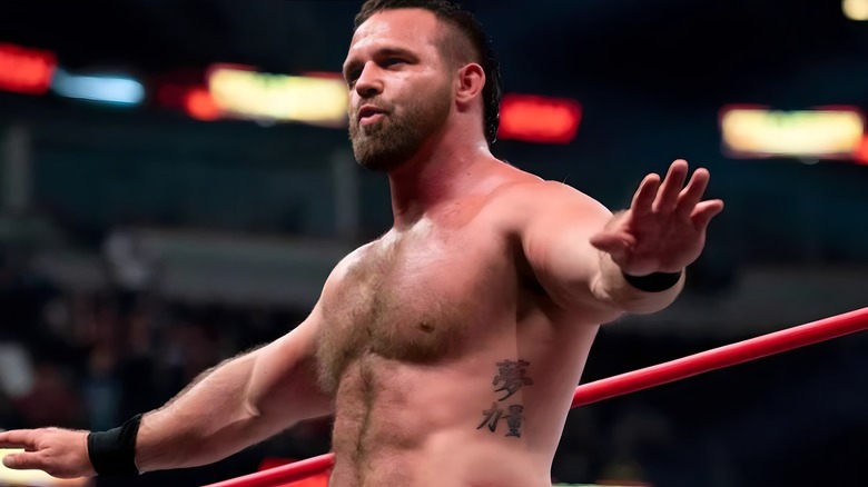 AEW's Cash Wheeler poses in the ring during a match.