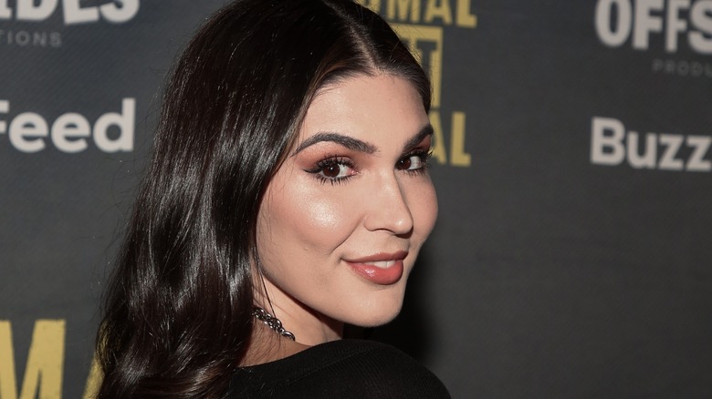 Cathy Kelley looking over her shoulder