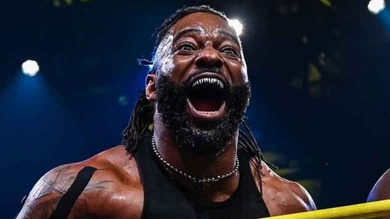 Cedric Alexander grins from ear to ear after hearing a match announcement on 