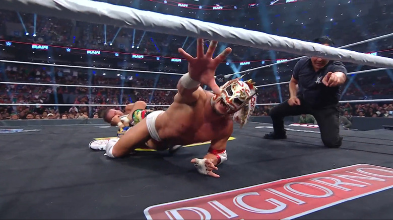 Chad Gable holds Dragon Lee in an ankle lock