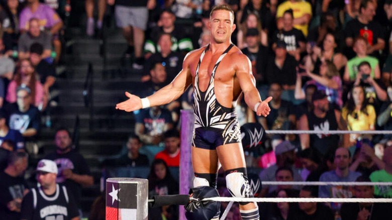 Chad Gable poses on the ropes and gestures toward the fans before a match on WWE programming.