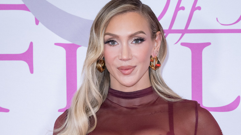 Charlotte Flair wearing shiny earrings