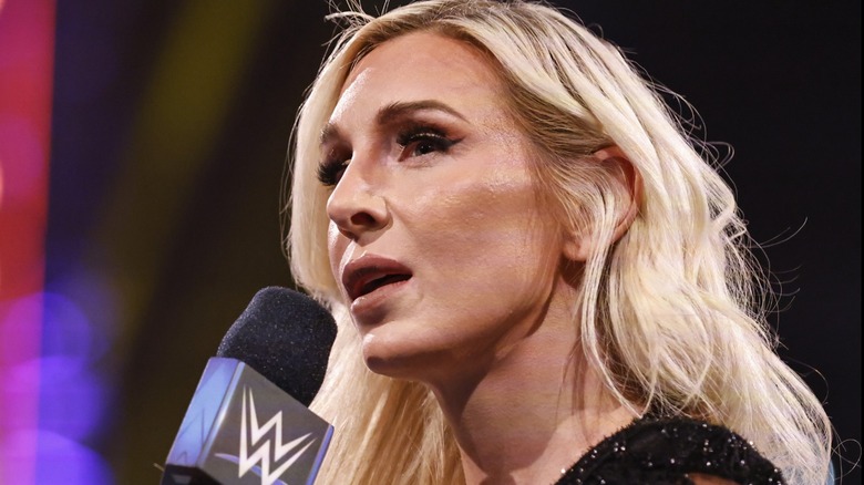 Charlotte Flair speaking into the mic