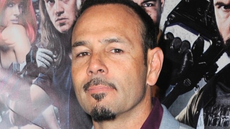 Chavo Guerrero Jr. posing in front of movie backdrop