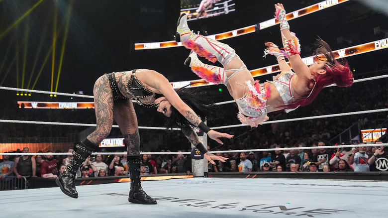 Rhea Ripley powerbombs IYO SKY at WWE Evolution