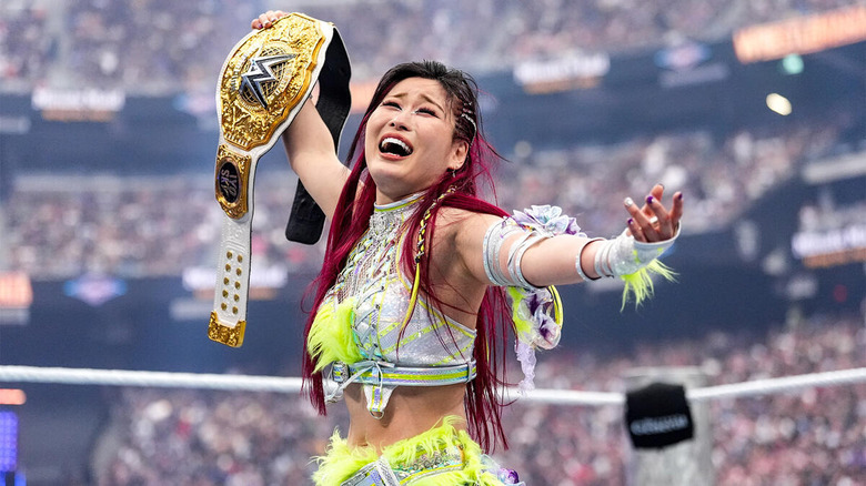 IYO SKY holds up women's world title at WWE WrestleMania 41