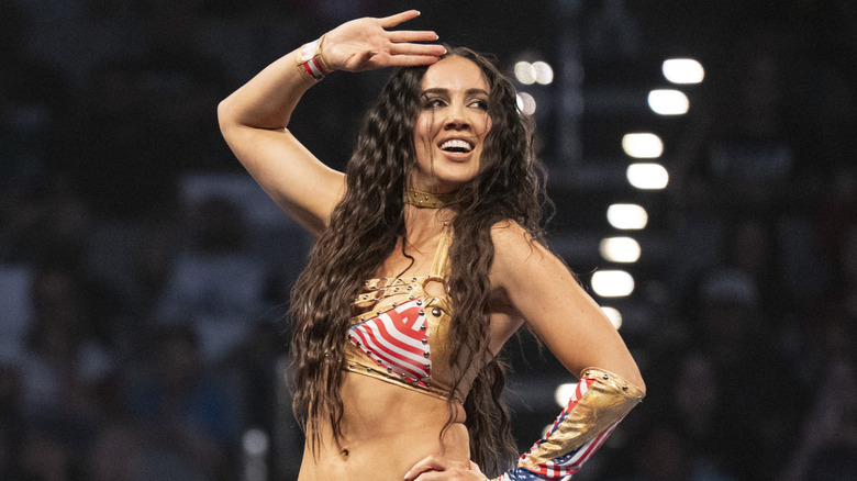 Chelsea Green saluting in front of a crowd