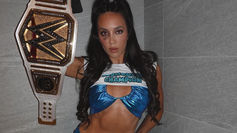Chelsea Green posing with the WWE Women's Championship for a picture on her Instagram.
