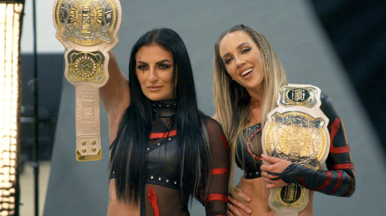 Chelsea Green posing with the tag team title