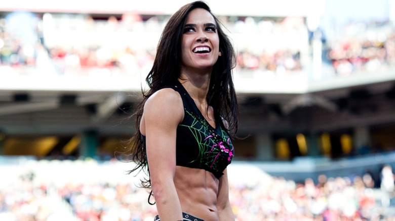 AJ Lee looks to the fans from the ring during a match on WWE programming.