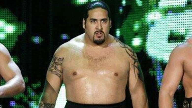 Manu makes his way down to the ring on an episode of WWE programming alongside Ted DiBiase Jr. and Cody Rhodes.
