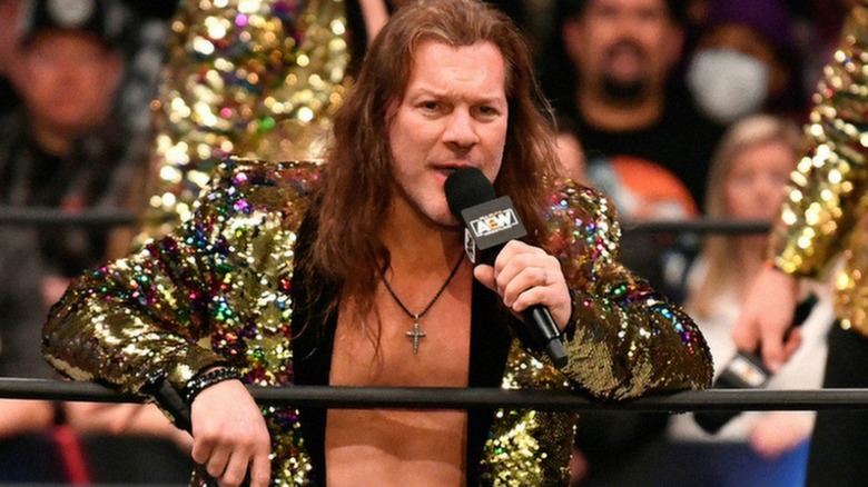 Chris Jericho wearing a gold sequined jacket