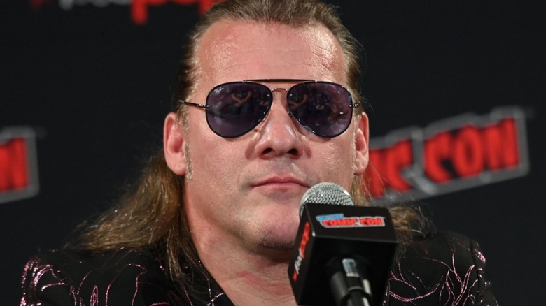 Chris Jericho on a convention panel rocking sunglasses