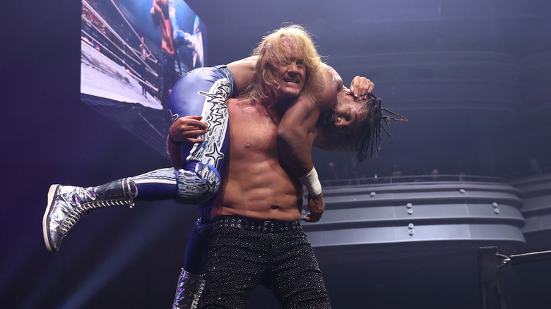 Chris Jericho hoists TNT Champion Kevin Knight on his shoulders, while on the ropes, during the August 12, 2026 edition of "AEW Dynamite."