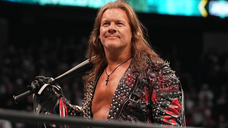 Chris Jericho smiling with his bat