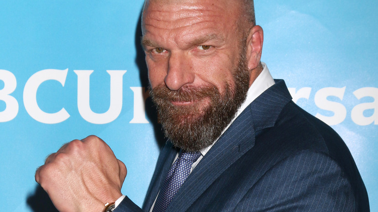 Triple H with fist raised