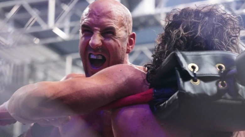 Claudio Castagnoli stands open mouthed after hitting Kenny Omega in the turnbuckle during AEW's Blood and Guts match.