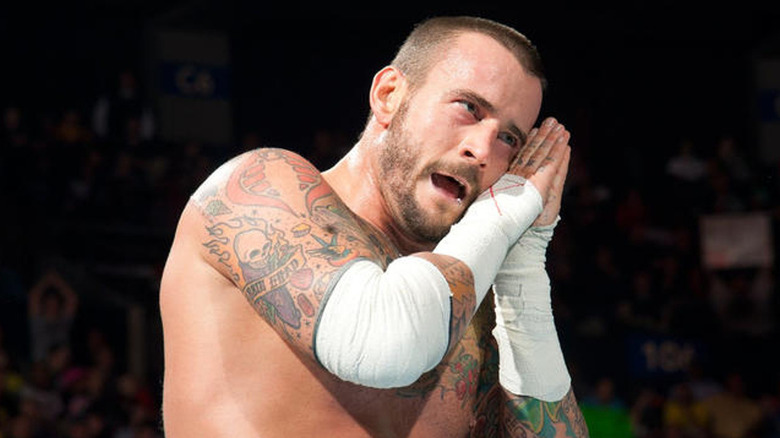 CM Punk standing in the ring