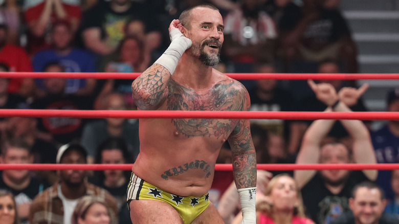 CM Punk cupping his ears
