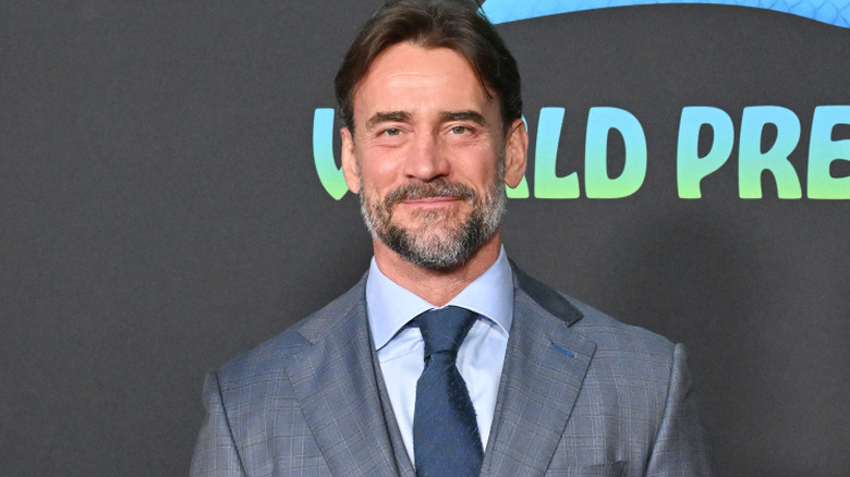 CM Punk is wearing a suit