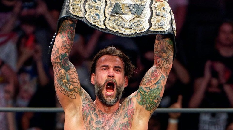 CM Punk with the title