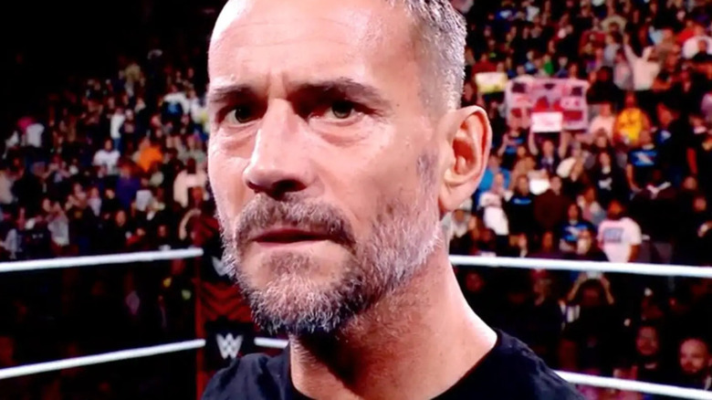 CM Punk looks intently at the camera.