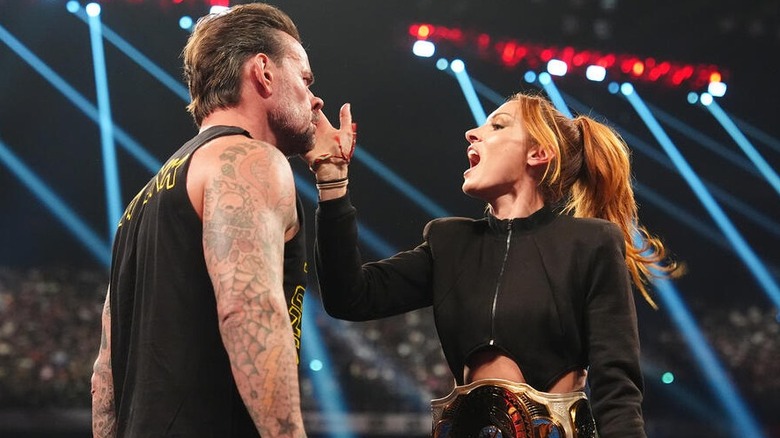 CM Punk takes a slap across the face from former Women's Intercontinental Champion Becky Lynch