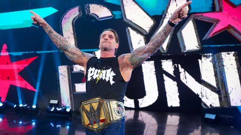 The newly crowned Undisputed WWE Champion CM Punk makes his way down the 